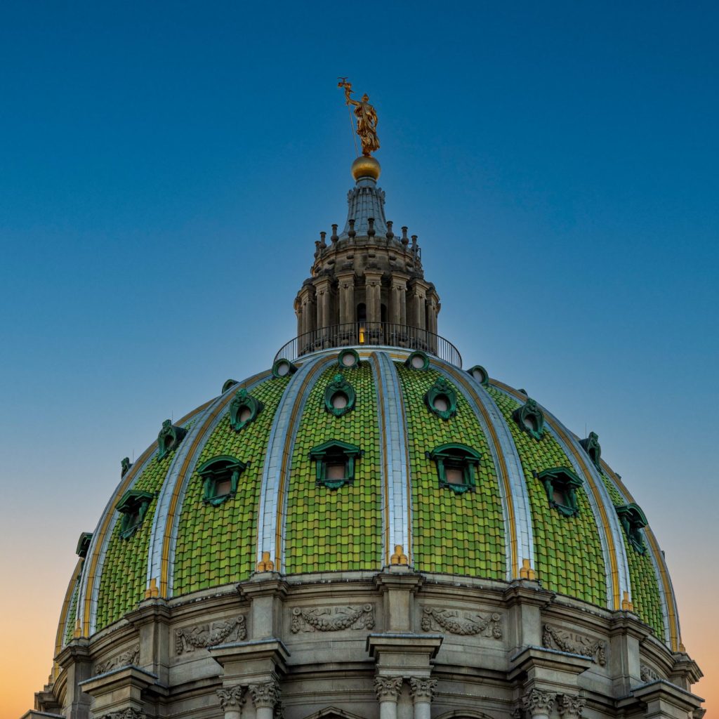 The dome of the Pennsylvania state capitol at dusk.