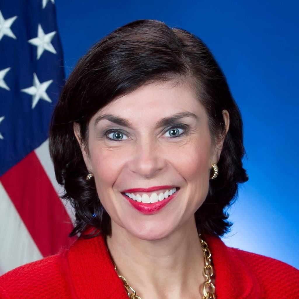 Portrait of a woman with American flag in the background